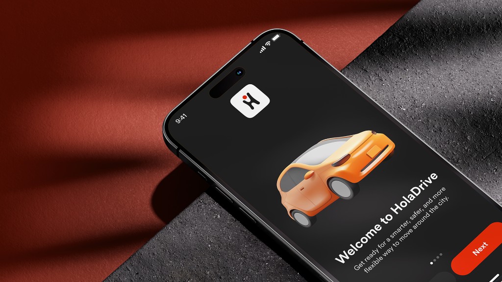 HolaDrive welcome screen on an iPhone: orange car, Next button, rust and stone backdrop.